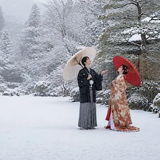Japanese wedding portrait with a janome umbrella in snow